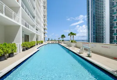 a swimming pool in the middle of a building at Luxury Suite | Sauna, Pool & Resort Access in Miami