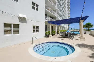 a swimming pool in front of a building at Luxe 2BD Unit | W Sauna, Pool & Gym access in Miami