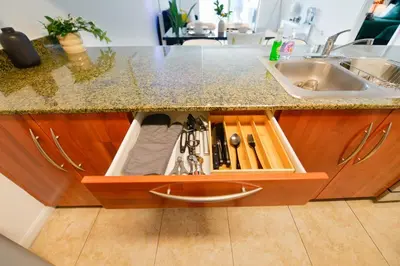 a kitchen counter with a sink and a drawer with tools at Luxury 2BD Condo | Sauna, Pool & Resort Access in Miami