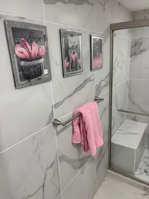 a bathroom with a shower with a pink towel at Peace and Tranquility awaits in Miami Gardens
