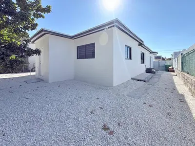 a white house with a gravel driveway at Miami Lux Retreat - Free Parking - Near Brickell in Miami