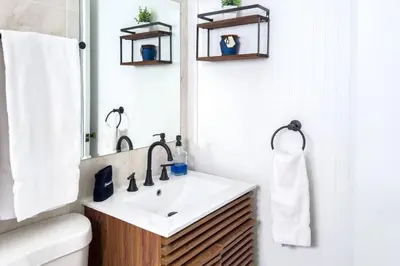 a bathroom with a sink and a mirror at Unit 4 Beautiful 1BR Apt w Parking Near Biscayne Blvd in Miami