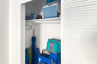 a closet with a computer and other items on a shelf at Hollywood 1 BR Apt w Gym and Pool near the Beach in Hollywood