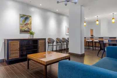 a waiting area with chairs and a table in a waiting room at Hollywood 1 BR Apt w Gym and Pool near the Beach in Hollywood
