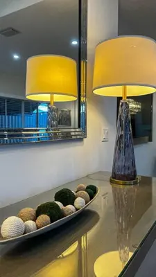 a table with two lamps on top of it at Casa Palma in Miami