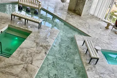 an overhead view of a pool with a bench and a table at Elegant 1B at Icon Brickell 17th fl Pool, Spa Gym FREE Parking Scenic view in Miami