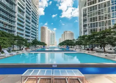 a large swimming pool in the middle of a city at Modern 1B at Icon Brickell 32nd fl Pool Spa Gym FREE Parking Scenic view in Miami