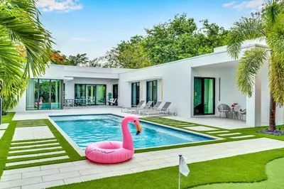 a house with a pink flamingo swimming pool at Private Villa with Heated Pool, Basketball Court and BBQ in Miami
