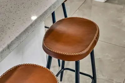 a couple of brown chairs sitting next to a counter at Bright 1BR Getaway Victoria Park Las Olas Nearby in Fort Lauderdale