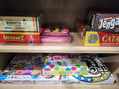 a shelf filled with different types of candy and snacks at Lux Villa Heated Pool, Gym, Games, Golf, Near Beach in Hollywood
