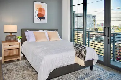 a bedroom with a bed and a large window at The Juliet VIII Vibe 8706 in Miami