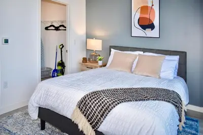 a bedroom with a large bed with pink pillows at The Juliet VIII Vibe 8706 in Miami