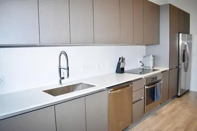 a kitchen with a sink and a stainless steel refrigerator at The Juliet VIII Vibe 8706 in Miami
