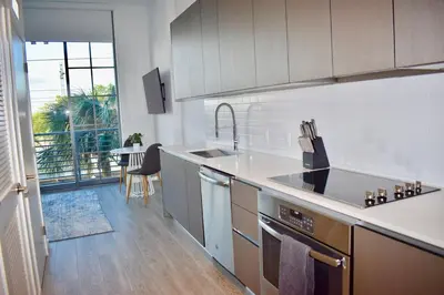 a kitchen with a sink and a stove top oven at The Juliet VIII Vibe 8706 in Miami