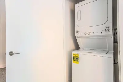a microwave oven sitting on top of a refrigerator at The Juliet XIV Vibe 8801 in Miami