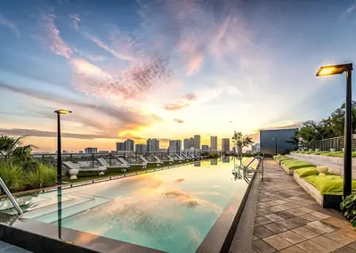 a swimming pool on top of a building with a city skyline at The Juliet XIV Vibe 8801 in Miami