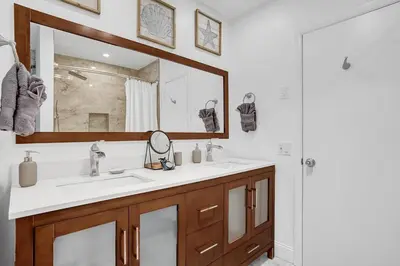 a bathroom with a sink and a mirror at Stylish 4 Bed 2 Bath Pool & Spa in Hollywood