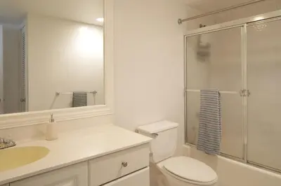 a bathroom with a toilet and a sink and a shower at Beautiful Sunny Isles apt 1br with PRIVATE TERRACE in Sunny Isles Beach