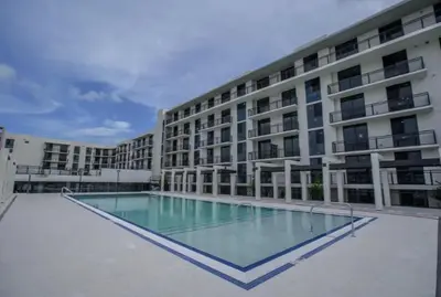 a large building with a swimming pool in front of it at High Floor Property-Expansive Views- Sleep 6 Miami in North Miami