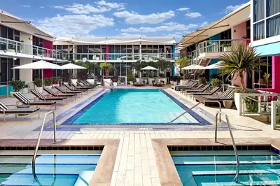 a swimming pool with chairs and a hotel at The Grayson Hotel Miami Downtown in Miami