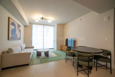 a living room with a couch and a table at Crosby Miami World Center in Miami