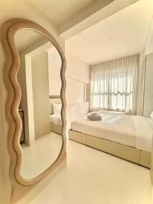 a bedroom with a large mirror and a bed at Chic & Cozy 1BR in Miami Best South Beach Location in Miami Beach