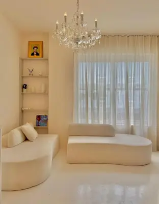a bedroom with two beds and a chandelier at Chic & Cozy 1BR in Miami Best South Beach Location in Miami Beach