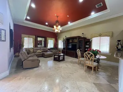 a large living room with a couch and chairs at Miami Mansion for Groups Sleeps 12 in Kendale Lakes