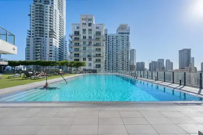 a large swimming pool on the roof of a building at Modern Miami Studio Near Brickell with Rooftop Pool in Miami
