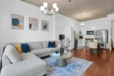 a living room with a couch and a table at Modern Luxury Studio for Two in Downtown in Miami