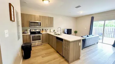 a kitchen with a sink and a stove top oven at Free Parking 15 Min to Hard Rock Stadium in Miami
