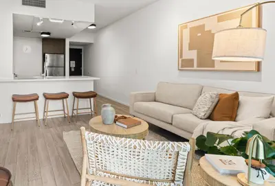 a living room with a couch and a table at Prime Downtown Stay 2BR- Parking Included -Near Bayside & Cruise Port in Miami