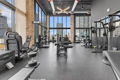 a gym with lots of treadmills and machines at Prime Downtown Stay 2BR- Parking Included -Near Bayside & Cruise Port in Miami