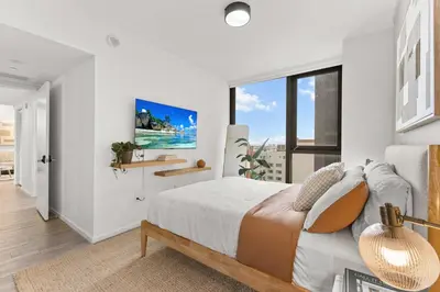 a white bedroom with a bed and a large window at Prime Downtown Stay 2BR- Parking Included -Near Bayside & Cruise Port in Miami