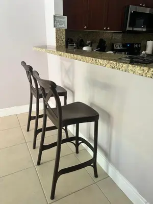 two chairs sitting at a counter in a kitchen at Vacation QJR in Cutler Bay