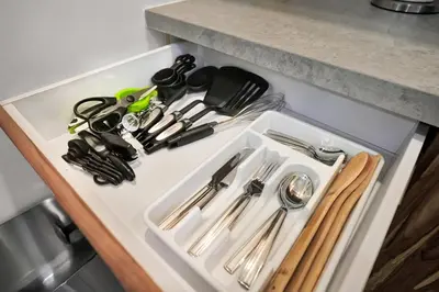 a white tray filled with utensils on a counter at Compact Miami Suite in Miami
