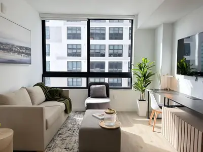 a living room with a couch and a table at Prime Downtown Location - Amazing Amenities & Top Location in Miami
