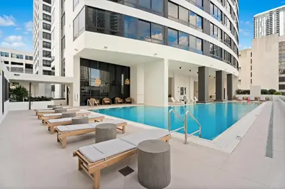 a swimming pool in a building with a building at Prime Downtown Location - Amazing Amenities & Top Location in Miami