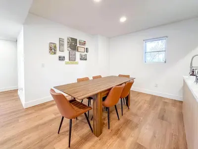 a dining room with a wooden table and chairs at Family Pool Retreat 3 BR House for more than 8 Guests in Hollywood