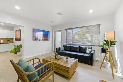 a living room with a couch and a table at Prime Location Miami House W Free Parking in Miami
