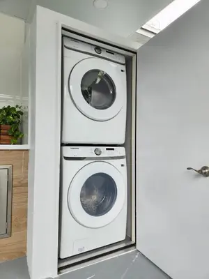a laundry room with a washer and dryer at Private & Quiet Retreat Near Hard Rock Stadium and Guitar Hotel in Pembroke Pines