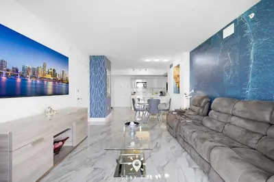 a living room with a couch and a table at One Bedroom - Amazing Balcony in Hallandale Beach