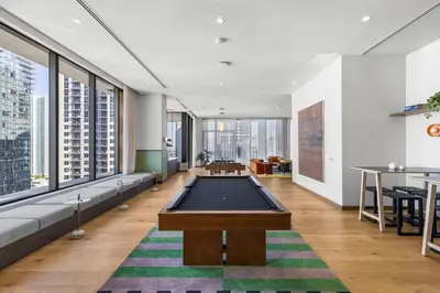 a living room with a pool table in it at Skyline Views - Steps from Bayfront Park in Miami
