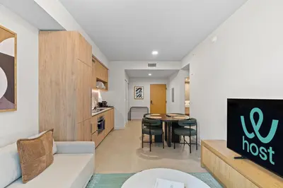 a living room with a couch and a table at Skyline Views - Steps from Bayfront Park in Miami