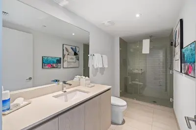 a bathroom with a sink and a toilet and a shower at Spectacular 3br and 2ba in Hyde Beach House in Hollywood