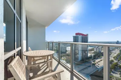 a balcony with a table and chairs and a view of the city at Spectacular 3br and 2ba in Hyde Beach House in Hollywood