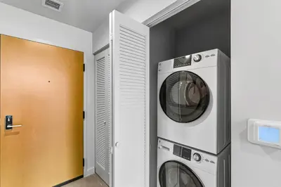 a washing machine and a dryer in a room at Modern Studio w Skyline Views by Bayfront Park in Miami