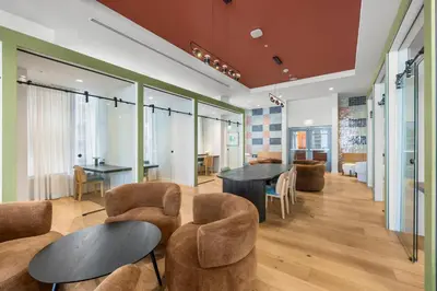 a lobby with tables and chairs in a building at Downtown lifestyle - Luxury condo & Rooftop Pool in Miami