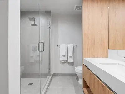 a bathroom with a shower and a toilet and a sink at Spectacular Cityviews - Steps from Bayfront Park in Miami
