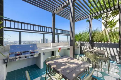 a patio with a table and chairs on a balcony at Spectacular Cityviews - Steps from Bayfront Park in Miami